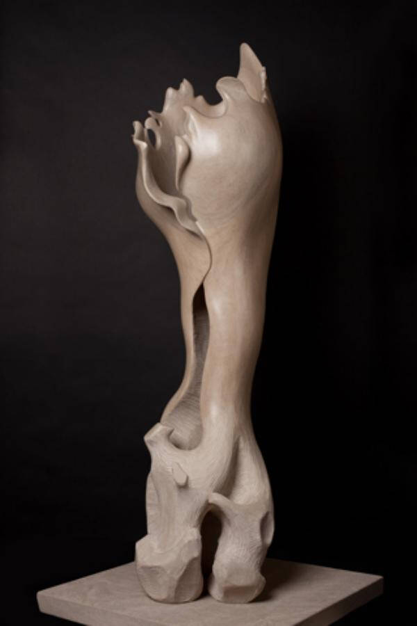 Carved stone sculpture that looks like a large, oversized bone.